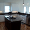 White Thermofoil w/Stained Island - Built for Christi Construction