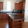 Glazed Cherry Thermofoil with Granite Countertops - Built for Mancuso Development